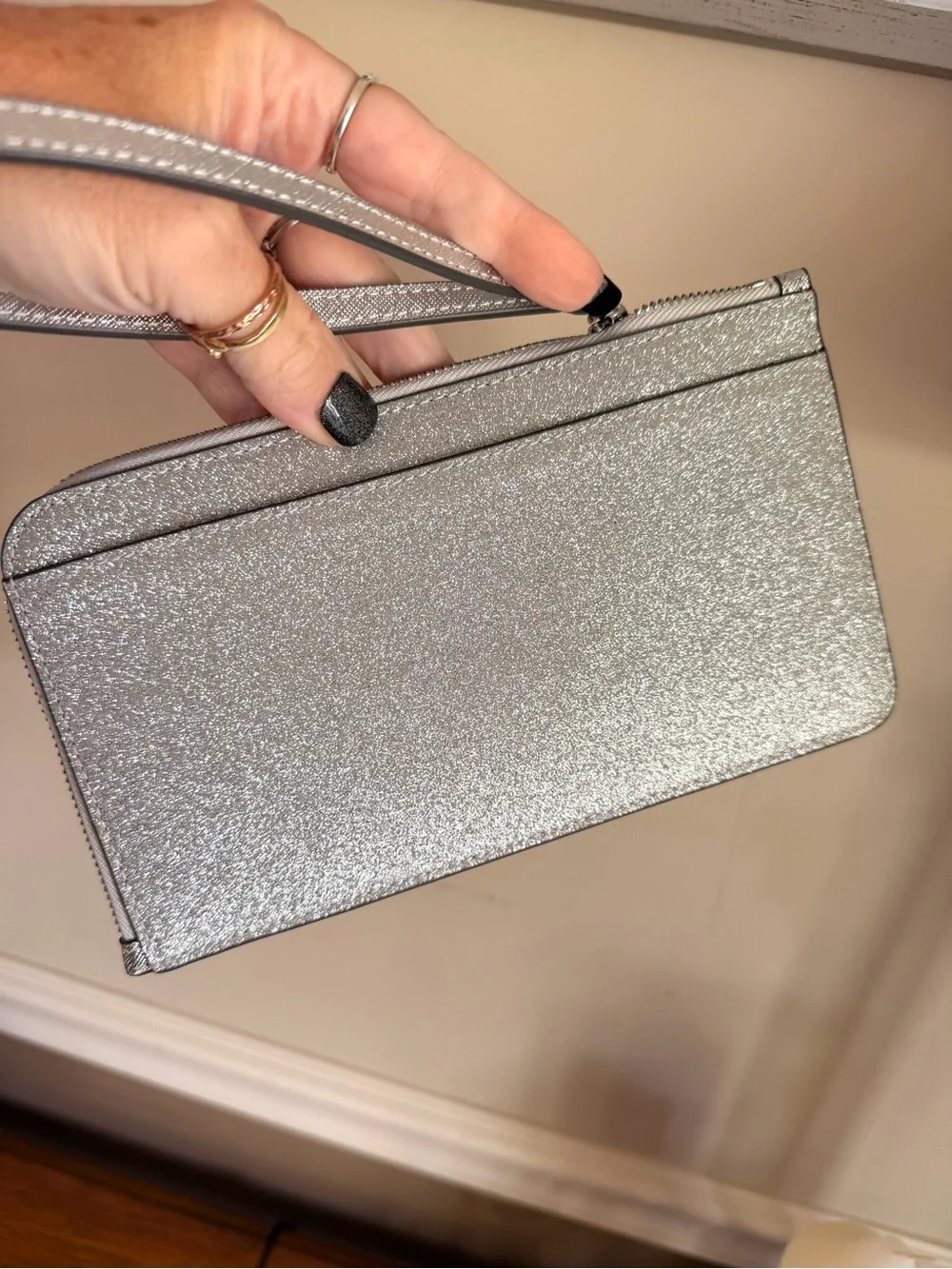 kate spade Lucy Silver Glitter Wristlet in color Lunar Light Like new
